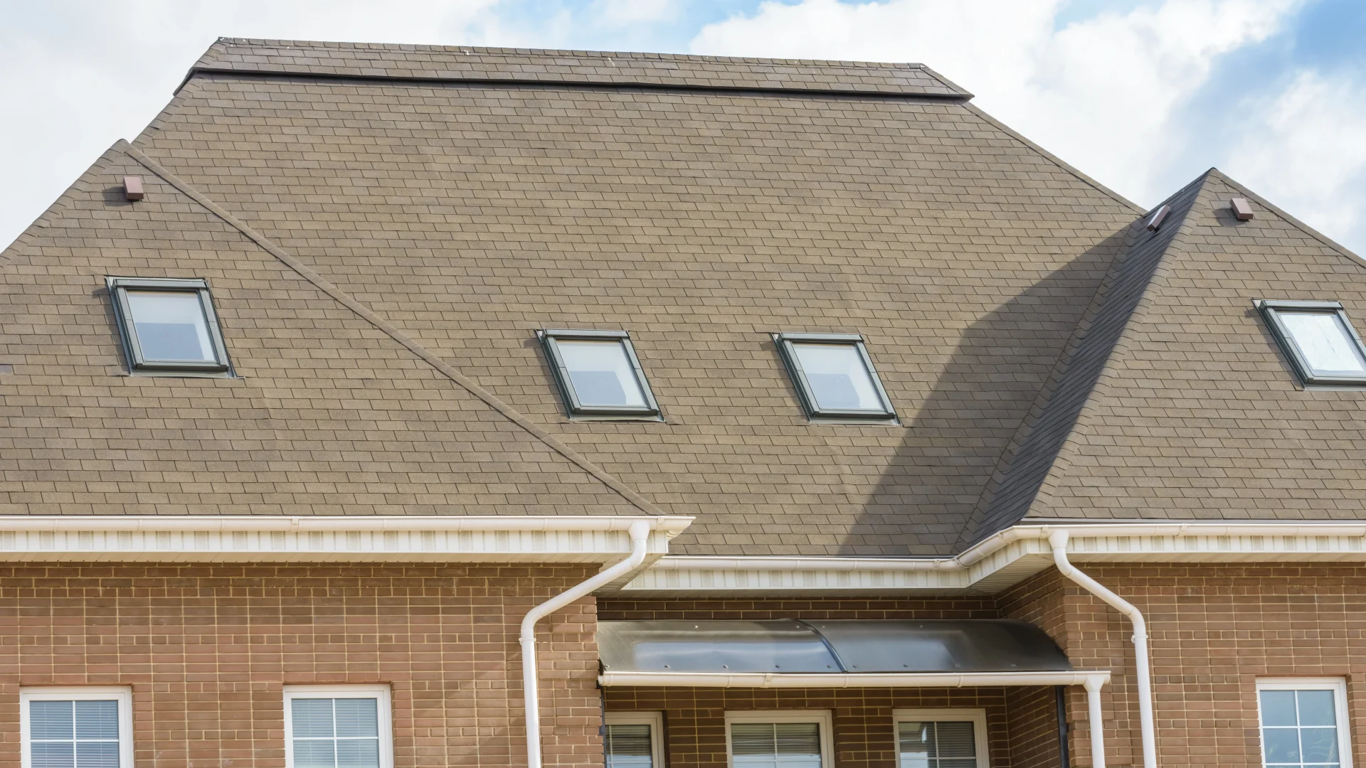 Large new asphalt shingle roof on luxury home
