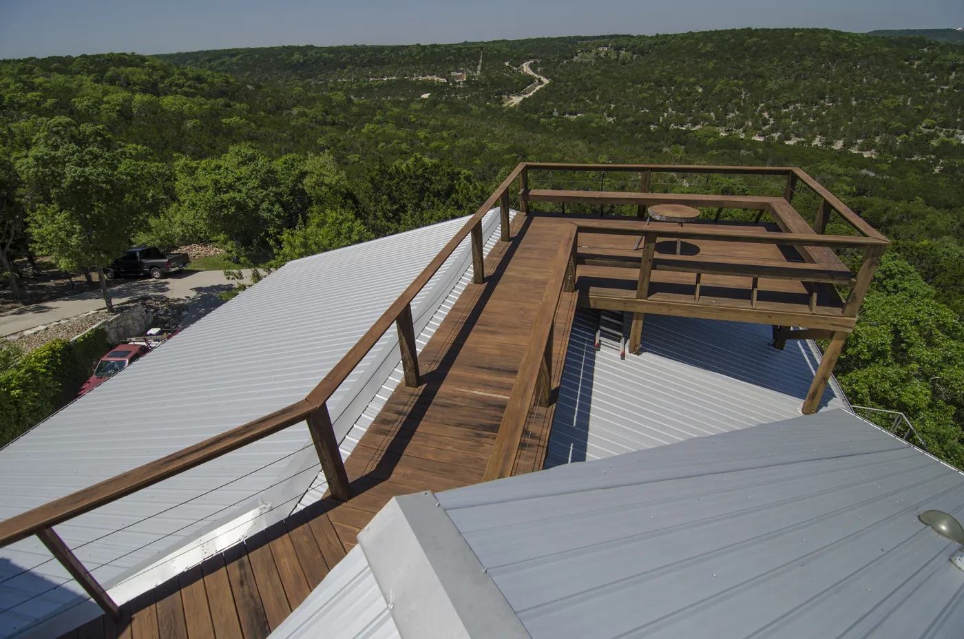 Metal Roof Tune Up with Wooden Deck Enhancement Austin Freetail Roofing