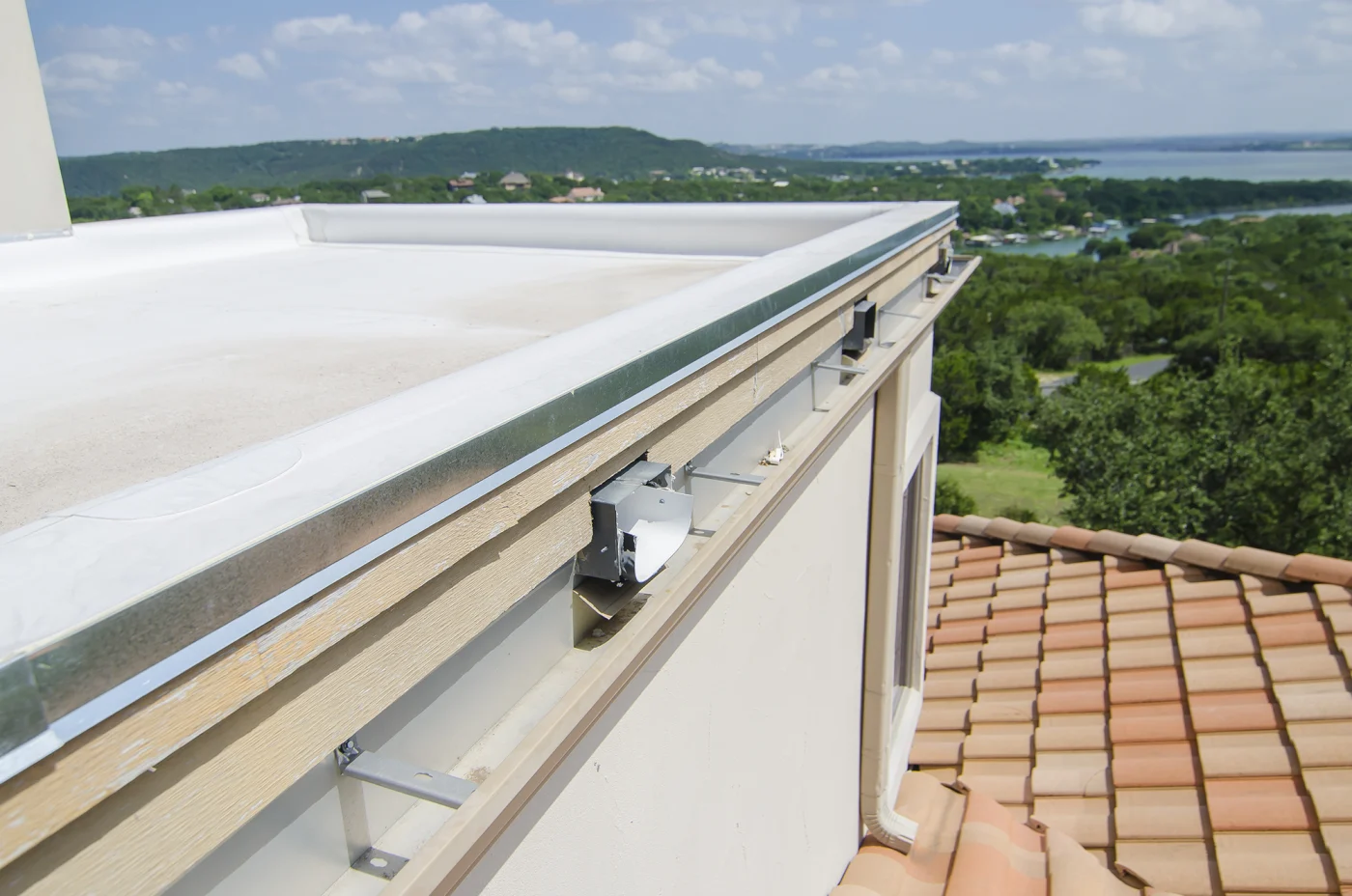 Finished Tpo Roofing Above Clay Tile Lake Travis Sunset View Freetail Roofing