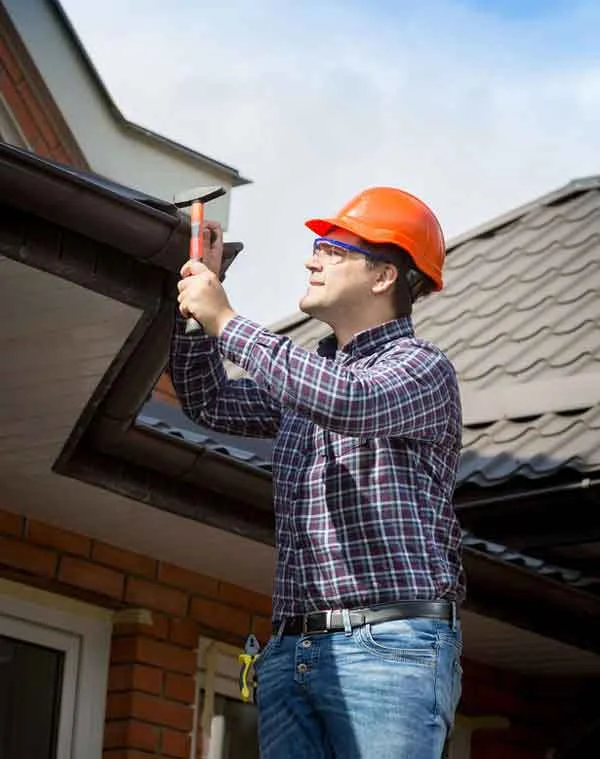 Inspector looking at a roof in Austin, TX