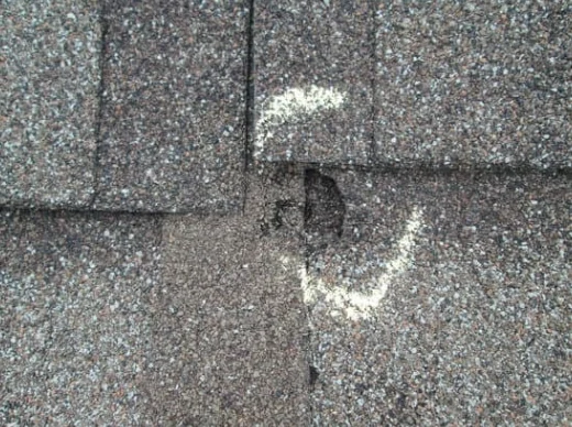 Hail Damage On Asphalt Roof Circled With Chalk By Roofers in Georgetown, TX | Freetail Roofing