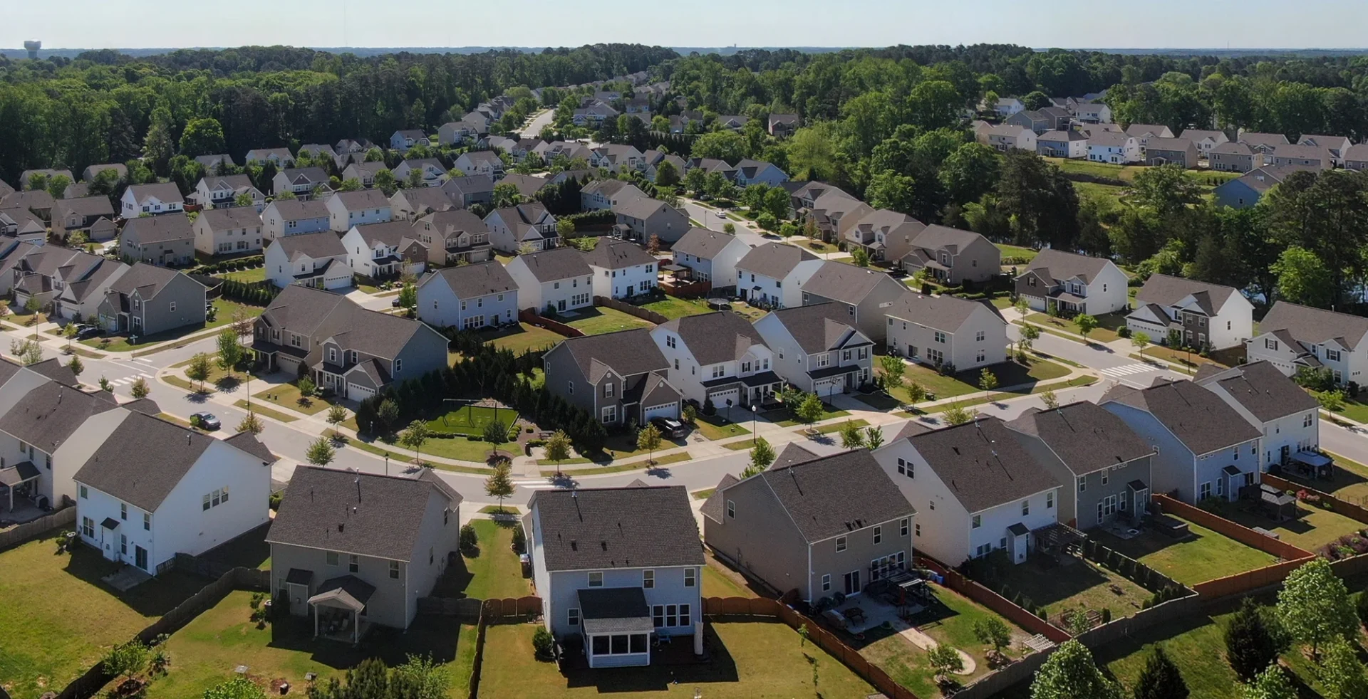 Residential neighborhood with asphalt shingle roofs