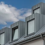 Gray standing seam metal roofing on modern home in Bertram, TX