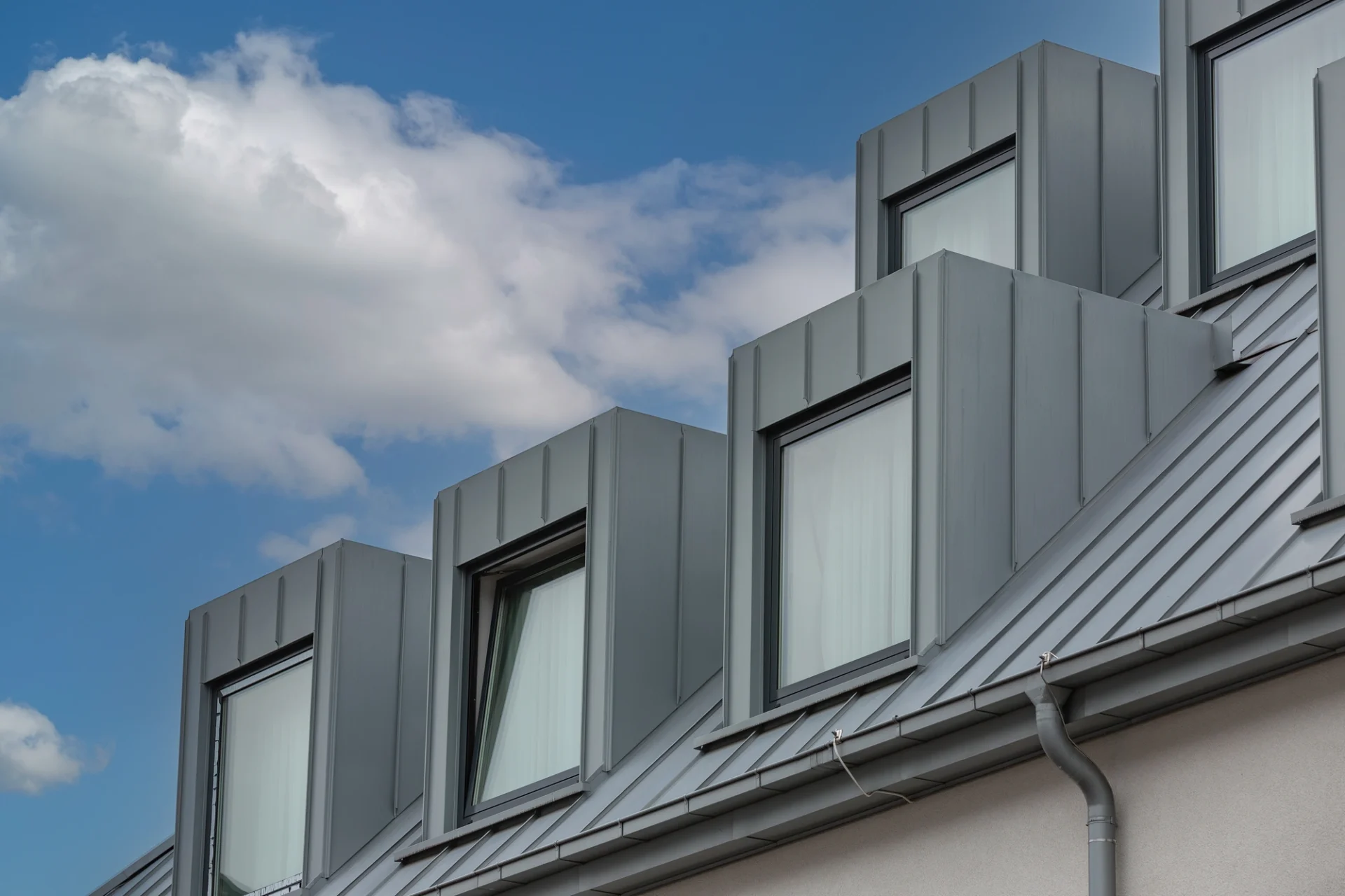 Gray standing seam metal roofing on modern home in Bertram, TX