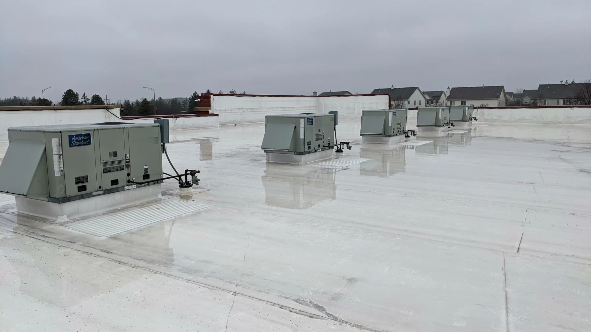 Flat commercial roof in rainy weather