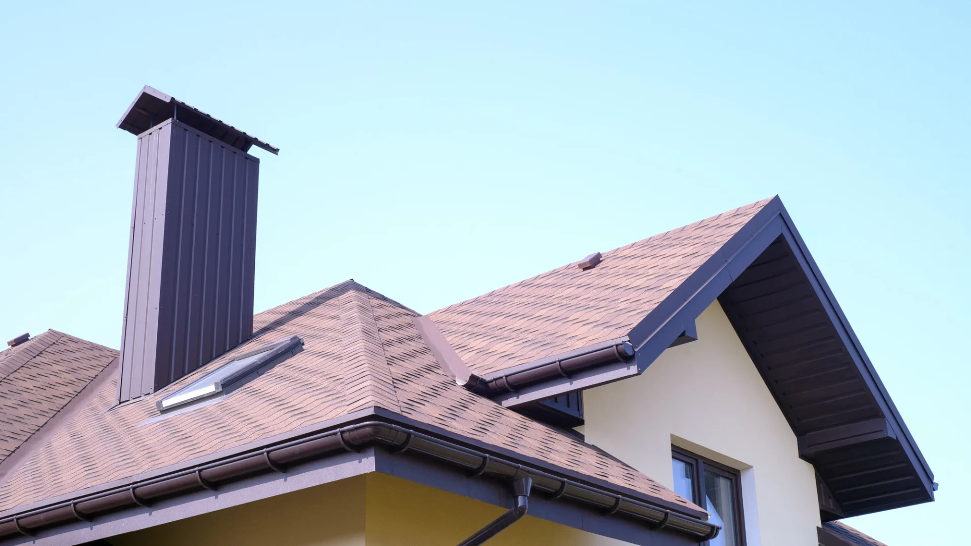 Complete Roofing Services Oak Hill, TX Freetail Roofing Upward view of a section of an asphalt shingle roof with a complex layout in Oak Hill, TX | Freetail Roofing