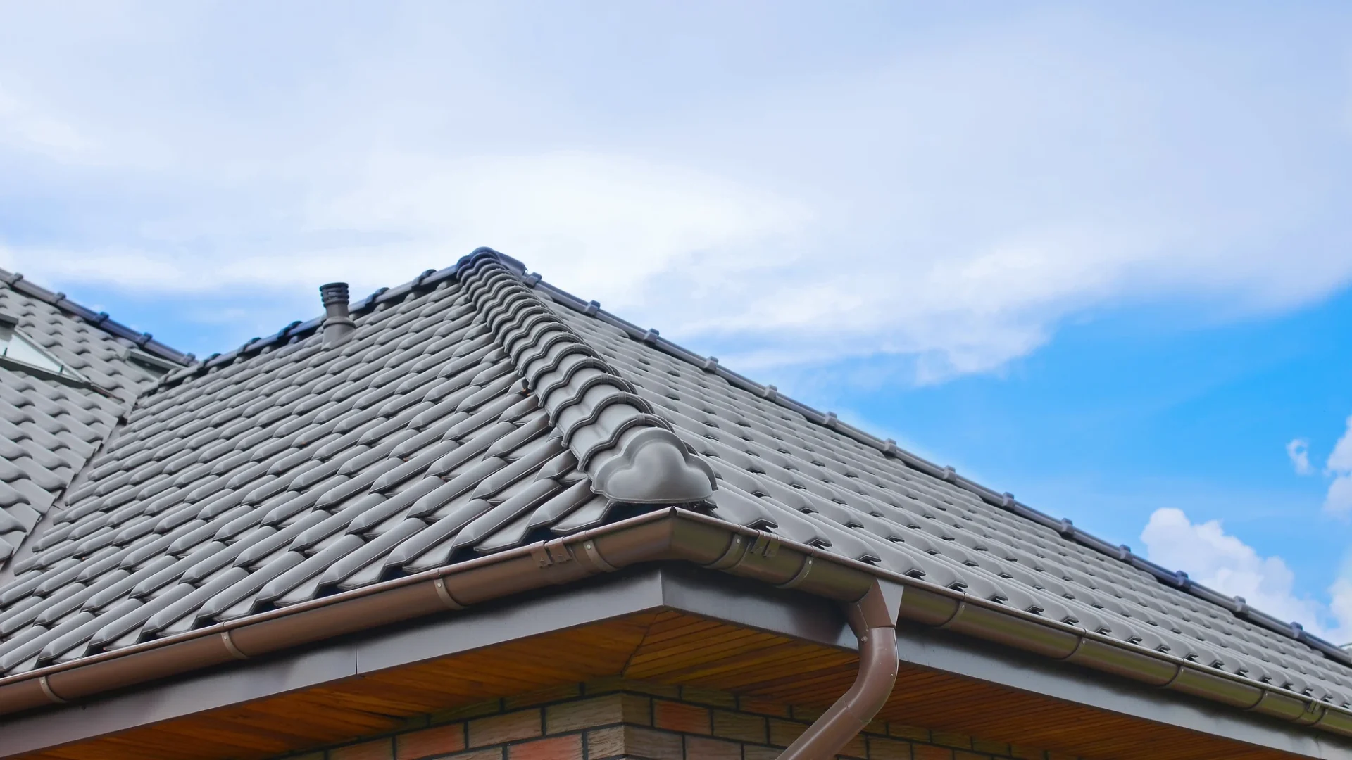 Upward angle of a section of a newly tiled residential roof in Oak Hill, TX | Freetail Roofing