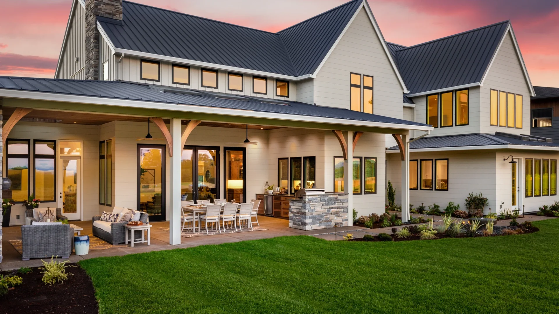View of a modern ranch-style home with a beautifully done standing seam roof