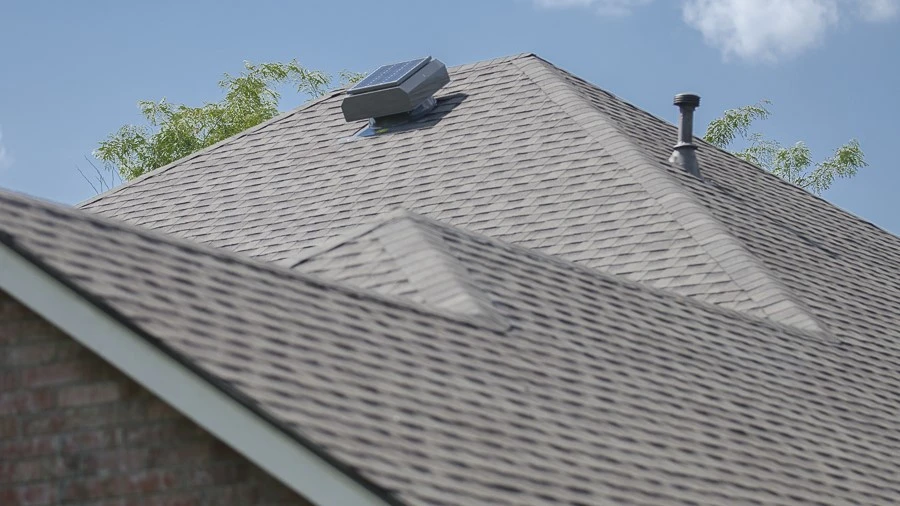 View of multiple sections of a newly done asphalt shingle roof