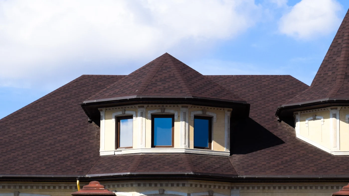 Quality Residential Roof Repairs In Liberty Hill, TX | Freetail Roofing Home with red asphalt shingle roofing