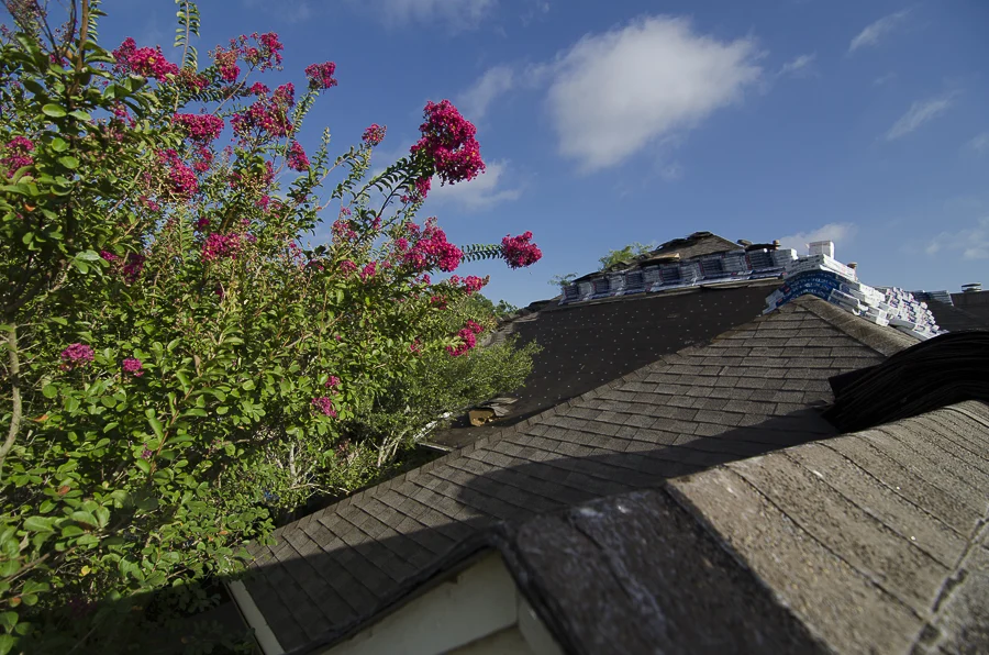Residential home in the process of having asphalt roof replaced
