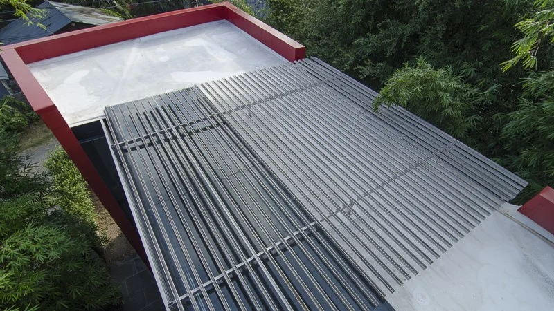 Home with flat TPO roof getting prepared for wooden deck installation
