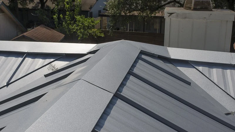 Beautifully installed peak of dark standing seam metal roof