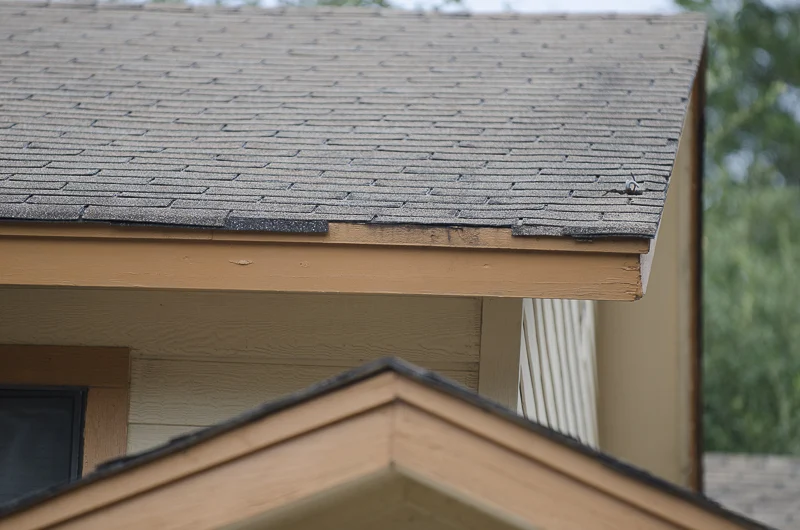 Roof Repair | Burnet, TX | Freetail Roofing Close-up image of a home with old, damaged shingles in Burnet,TX | Freetail Roofing