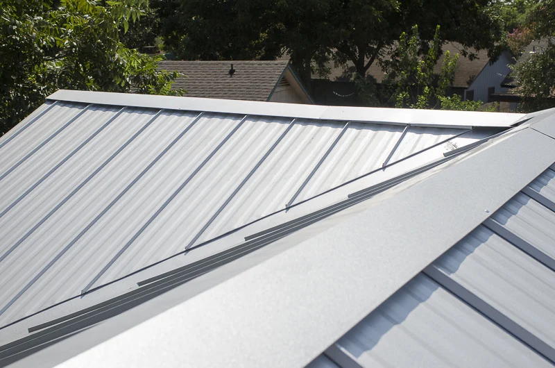 A close-up view of a new metal roof on a house.